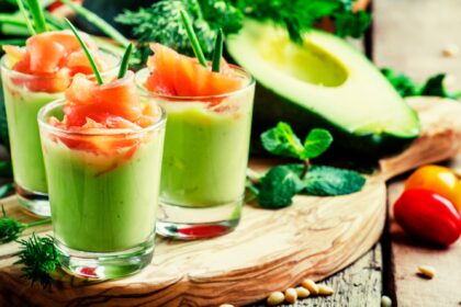 Appetizer with smoked salmon and avocado mousse, served in glasses