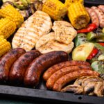 Grilled sausages, meat, and vegetables.