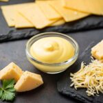 Homemade cheese sauce in glass bowl