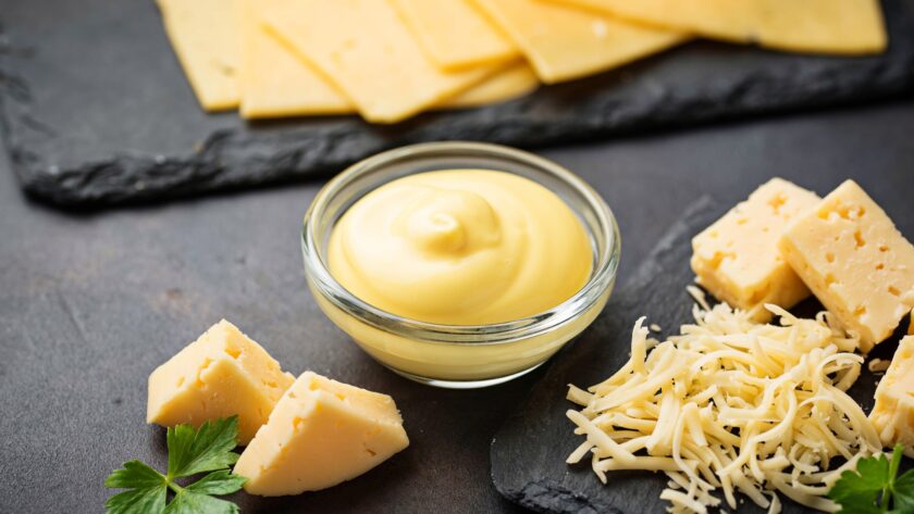 Homemade cheese sauce in glass bowl