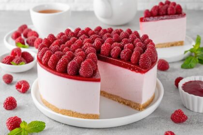 No baked raspberry cheesecake or raspberry cream mousse cake with jelly and fresh berries on top