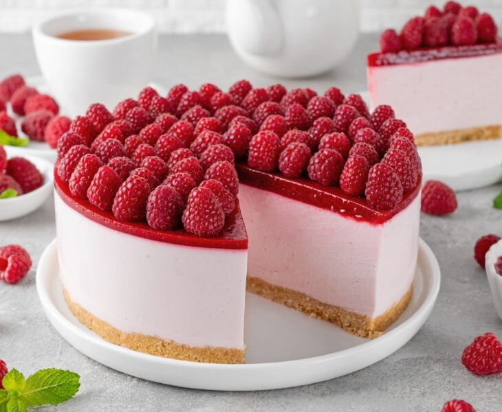 No baked raspberry cheesecake or raspberry cream mousse cake with jelly and fresh berries on top