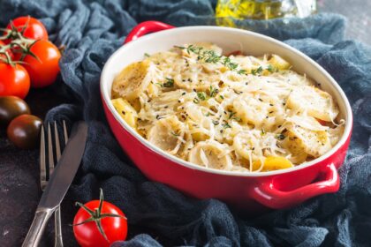Potato gratin, in rustic dish.