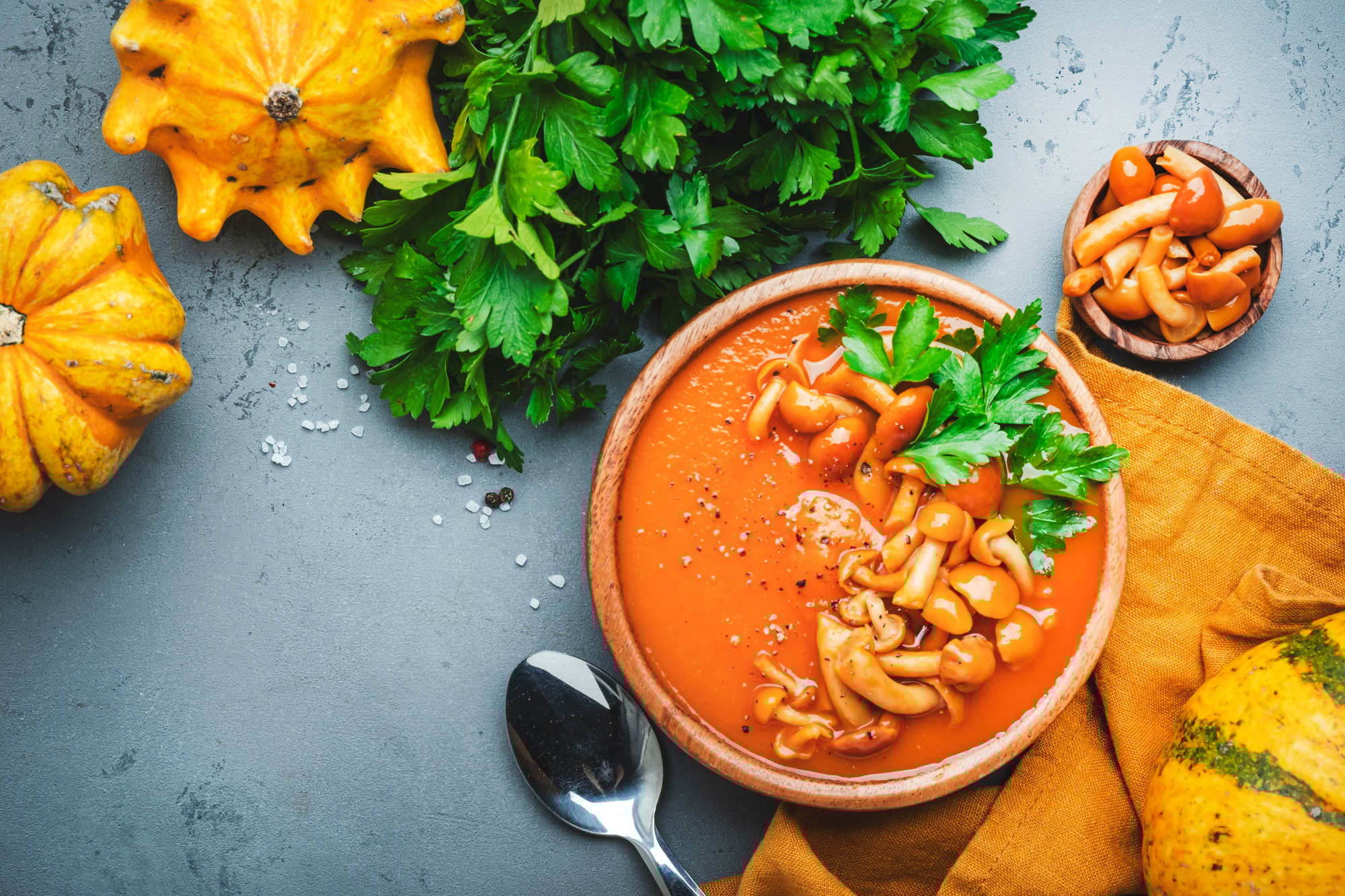 Vegan pumpkin soup puree with mushrooms, pepper and parsley.