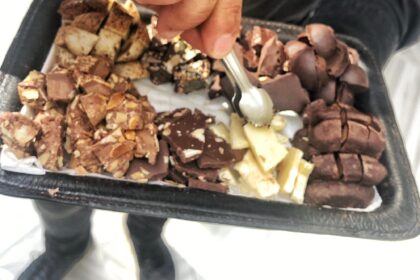 Chocolate Chocolatier giving away free samples of organic chocolate at a new local store
