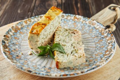 Salmon and dennis pate, sliced slices on plate of basil. French gourmet cuisine
