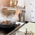 Shellfish mussels cooking in pan.